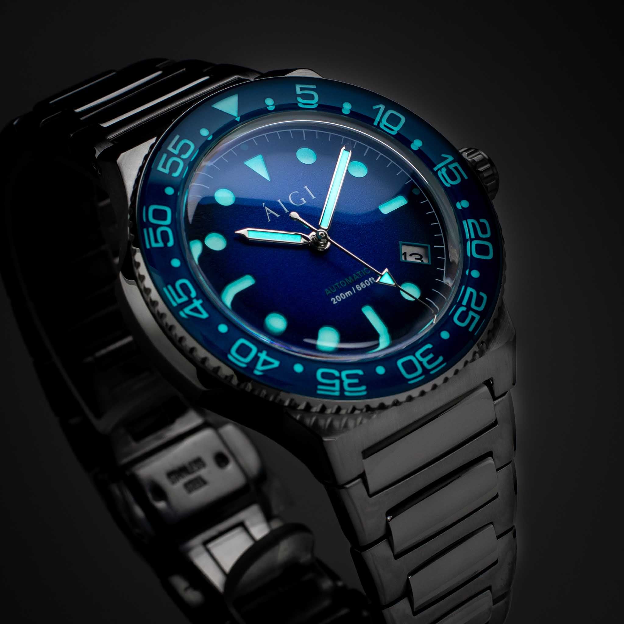 AIGI Arctic Diver automatic men’s watch with deep-blue dial glowing lume in darkness.